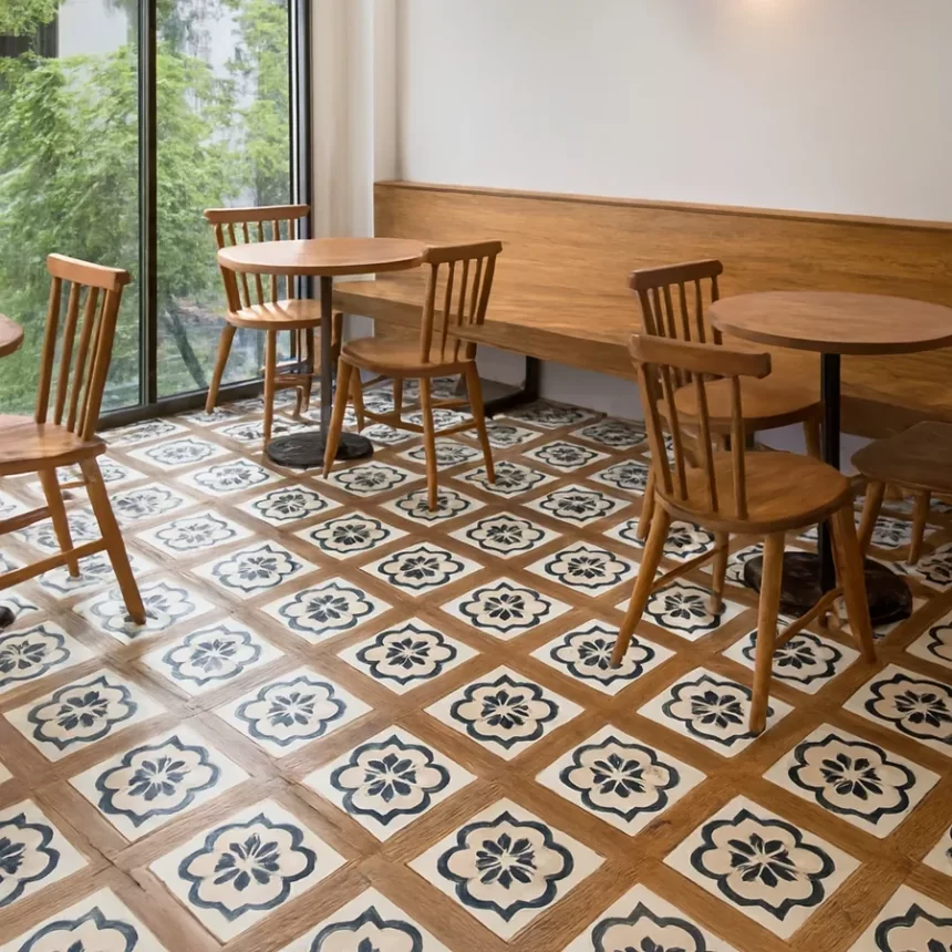 Không gian quán cafe lát gạch Novita WOOD HARMONY 60x60 Gạch bông Novita WOOD HARMONY 60x60 lát sàn ở quán cafe hiện đại, giữ nguyên hoa văn nâu gỗ, nền trắng và đen