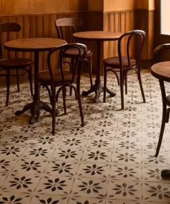Không gian quán cà phê phong cách retro, nền lát gạch bông Novita OLIVE 2205 với hoa văn nổi bật, ánh sáng tự nhiên ấm áp
