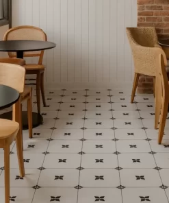 Quán cafe lát sàn bằng gạch bông Novita OLIVE 2211 đúng hoa văn góc cạnh, bề mặt matt, màu trắng đen tự nhiên.