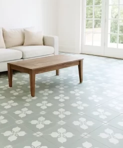 Hình ảnh gạch bông 30x30 Novita MIMOSA 3318 lát nền trong phòng khách hiện đại, thể hiện rõ hoa văn gạch màu xanh xám nhạt và trắng, vân matt tự nhiên.