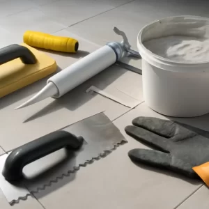Bộ công cụ thi công keo chít mạch với bay chít, súng bắn keo và bi cầu miết ron trên nền vật liệu thi công